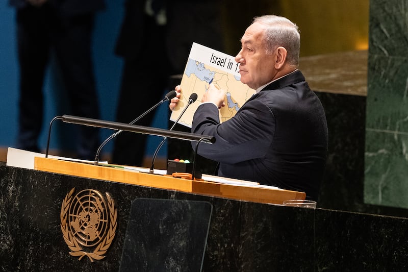 Prime Minister of Israel Benjamin Netanyahu holds up a map of Israel at the 78th Session of the General Assembly of the UN.