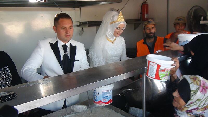 articles/2015/08/04/the-most-generous-bride-of-earth-couple-feeds-4-000-syrian-refugees-on-their-wedding-day/150804-strochlic-turkish-wedding-embed_keyd3v