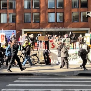 Protesters march at NYU's "Gaza Solidarity Encampment" in New York City on April 22, 2024.