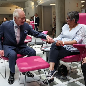 King Charles meets with patients during a visit to the University College Hospital Macmillan Cancer Centre in London, April 30, 2024. 