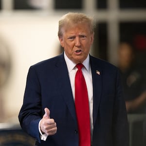 Former U.S. President Donald Trump speaks to the media as he arrives for his criminal trial for allegedly covering up hush money payments at Manhattan Criminal Court on April 25, 2024 in New York City. 