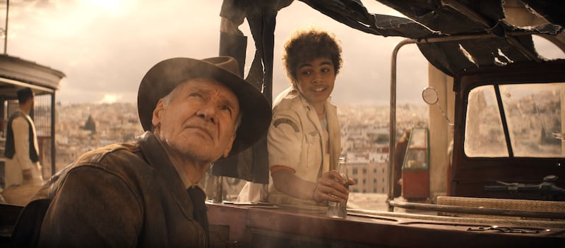 Harrison Ford gazing at the sky in a fedora in 'Indiana Jones and the Dial of Destiny.'