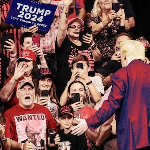 A photo illustration showing a crowd of screaming for Donald Trump during the South Dakota Republican Party's Monumental Leaders rally at the Ice Arena at the Monument in Rapid City, South Dakota, September 8, 2023