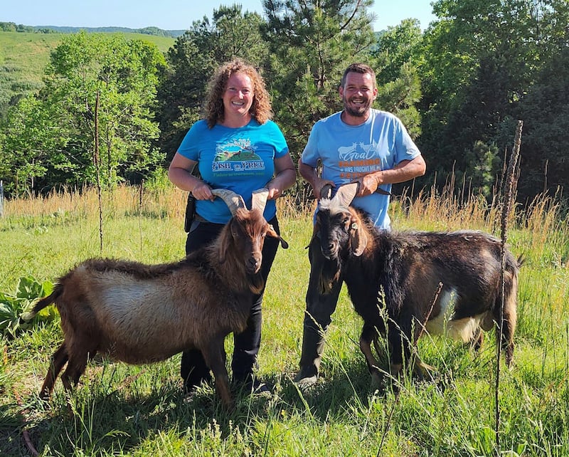 Sarah Fish and her husband with two of their goats.