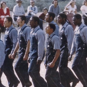 Members of Synanon marching in “Born in Synanon” documentary.