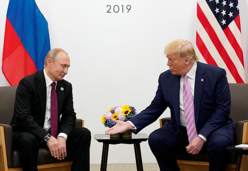 Then U.S. President Donald Trump and Russia’s President Vladimir Putin at the G20 leaders summit in 2019