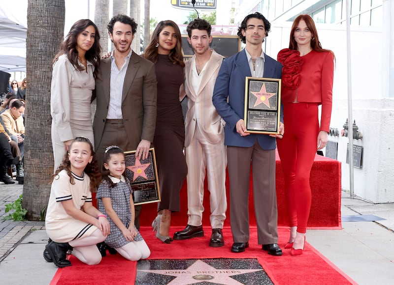 Danielle Jonas, Kevin Jonas, Priyanka Chopra, Nick Jonas, Joe Jonas, Sophie Turner, and Alena Rose Jonas and Valentina Angelina Jonas attend The Hollywood Walk of Fame star ceremony.