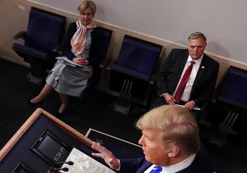 Donald Trump in the White House briefing room seen from above