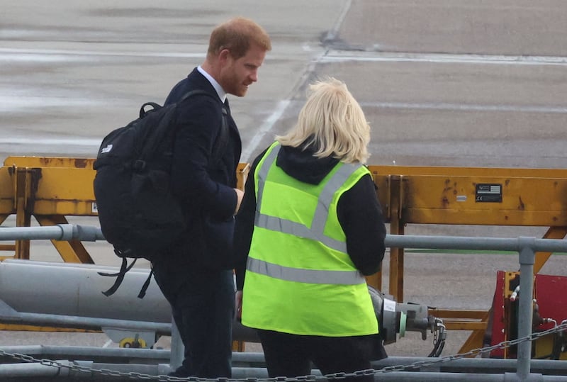 Britain's Prince Harry boards a plane at Aberdeen International Airport, following the passing of Britain's Queen Elizabeth, in Aberdeen, Britain, September 9, 2022.