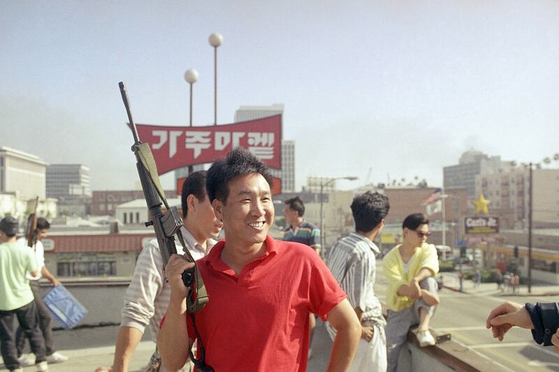 galleries/2012/04/26/dramatic-l-a-riots-photos/los-angeles-riots-smiling-korean_z2ldlg