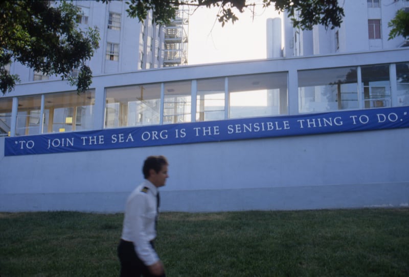 A member of the "Sea Org" walks outside the Church Of Scientology Los Angeles Buidling on Sunset Boulevard in 1992.