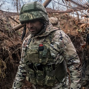 Ukrainian soldier is seen in his combat position in a trench in Niu York, Ukraine.