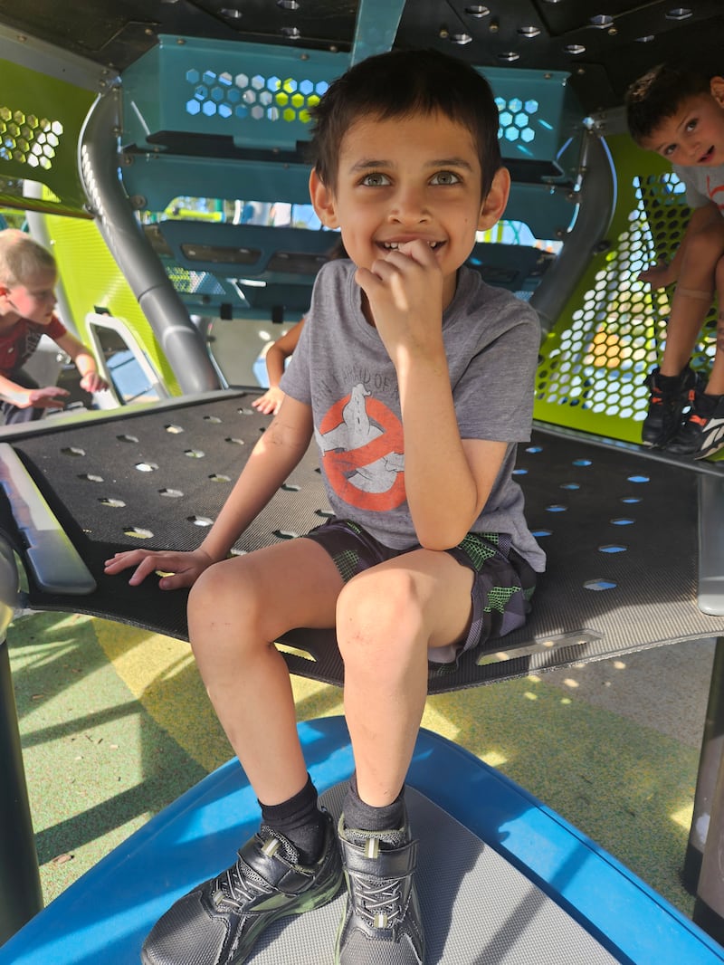 Eight-year-old Aedrik plays at a local playground that he has vowed to visit every single day since his diagnosis.