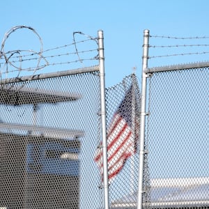 A US flag waves at the San Ysidro crossing port in the US-Mexico border seen from Tijuana, Baja California state, Mexico.