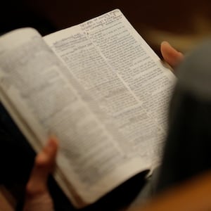 A woman reads her bible before the Exalt Showcase of gospel and Christian music at Central Presbyterian Church at the South by Southwest (SXSW) Music Film Interactive Festival 2017 in Austin, Texas, U.S., March 14, 2017.