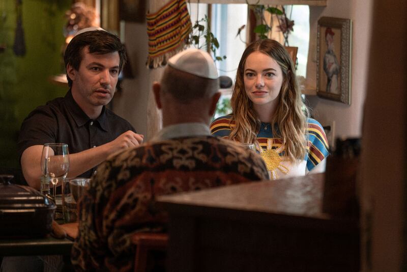 Nathan Fielder and Emma Stone sit in a booth in a restuarant in a still from 'The Curse'