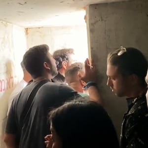 A group seeks safety inside a bomb shelter in the documentary feature 'We Will Dance Again'