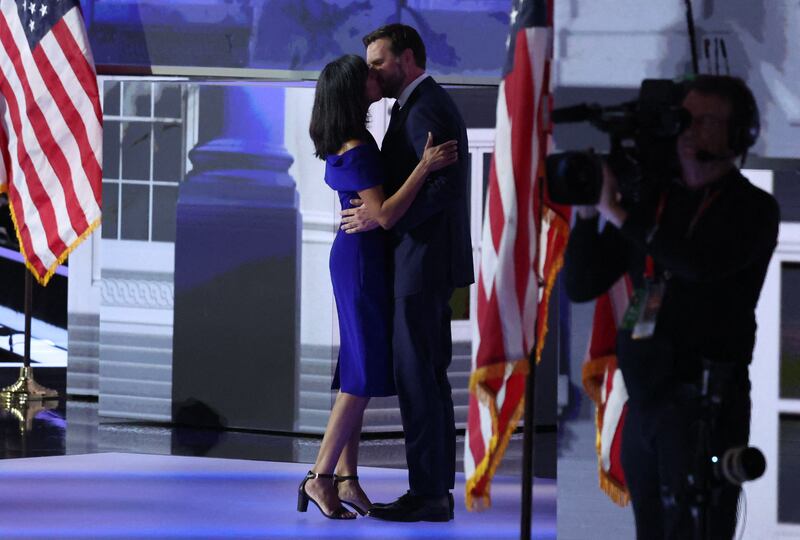 Usha Vance and her husband J.D. Vance, share a kiss on stage at the Republican National Convention in Milwaukee.