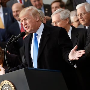 U.S. President Donald Trump celebrates with Congressional Republicans after the U.S. Congress passed sweeping tax overhaul legislation, on the South Lawn of the White House in Washington, U.S., December 20, 2017.