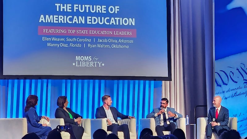 A group photo that includes Education Leaders such as Ellen Weaver, South Carolina, Jacob Oliva, Arkansas, Manny Diaz, Florida, Ryan Walters, Oklahoma at the Moms of Liberty Conference.