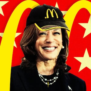 Kamala Harris with a McDonald's Hat in front of the Golden Arches.