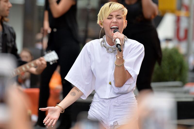 articles/2013/10/08/miley-cyrus-s-craziest-lyrics-from-bangerz-analyzed/131007-zimmerman-miley-tease_qu2ics