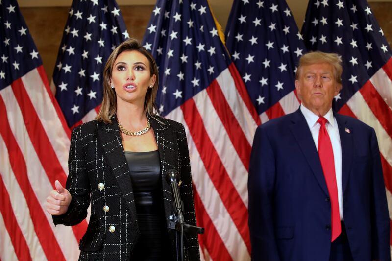 Former U.S. President Donald Trump stands with his attorney Alina Habba as she speaks to the media at one of his properties, 40 Wall Street, after giving closing arguments in his civil fraud trial on January 11, 2024 in New York City.