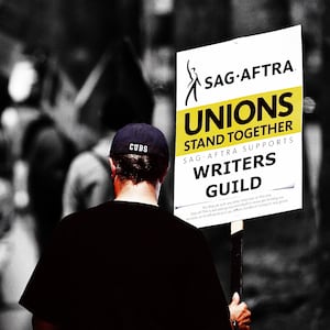 An illustration including a  SAG-AFTRA member holding a sign that reads Unions Stand Together during WGA Strike.