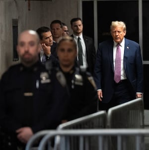 Former U.S. President Donald Trump speaks to the media at the end of the day during his criminal trial as jury selection continues at Manhattan Criminal Court.