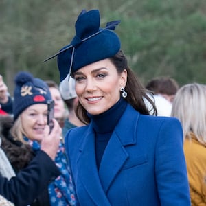 Catherine, Princess of Wales (L) and Prince William, Prince of Wales (2nd R) with Prince Louis of Wales (R), Prince George of Wales (C) and Princess Charlotte of Wales (2nd L) attend the Christmas Day service at St Mary Magdalene Church on December 25