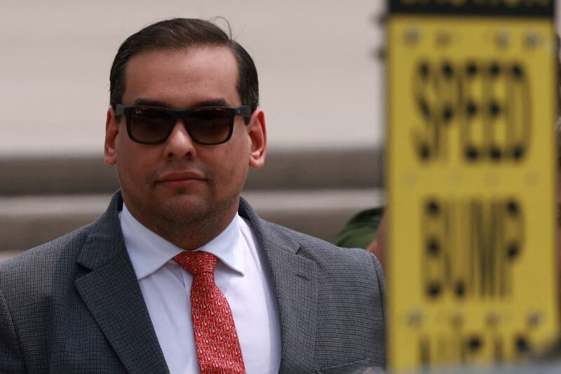 George Santos (R-NY) looks on outside the Central Islip Federal Courthouse on the day of his hearing