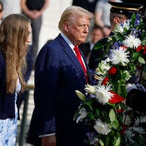 Donald Trump hangs a wreath at Arlington National Cemetery.