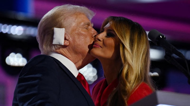 Melania Trump hugs Donald Trump on stage at the RNC.