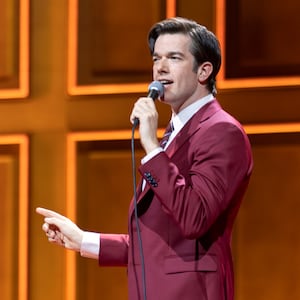 John Mulaney on stage performing "Baby J" at the Boston Symphony Hall