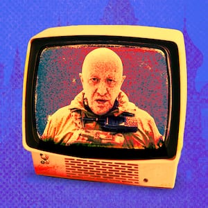 A photo illustration of Wagner leader Yevgeny Prigozhin inside a television superimposed over an image of the Kremlin in Moscow.