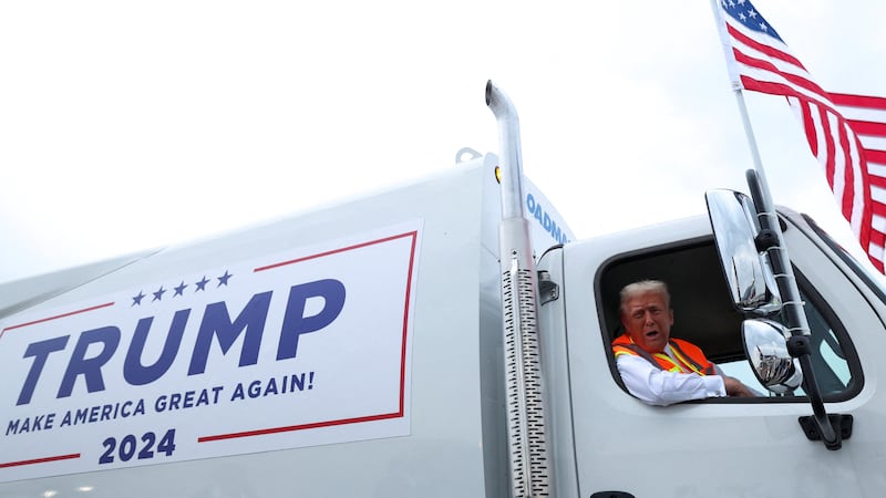 Republican presidential nominee and former U.S. President Donald Trump sits inside garbage truck, in Green Bay, Wisconsin, U.S., October 30, 2024.