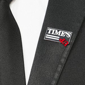 A photo illustration showing the Time’s Up movement pin, with the Up flipped upside down.