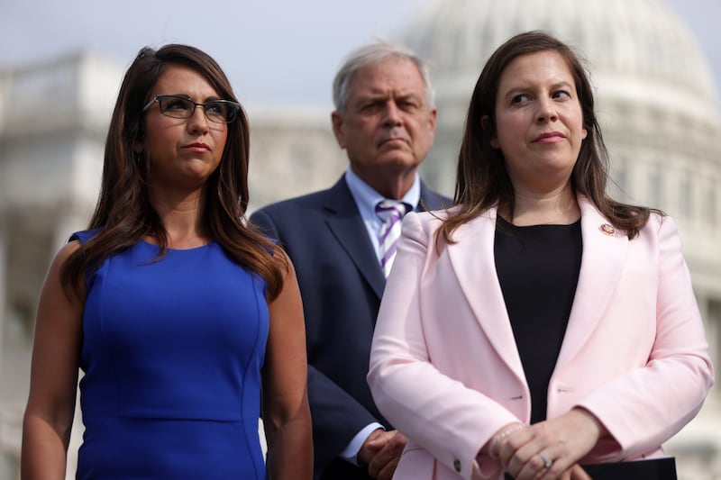 Elise Stefanik listens to a news conference with Rep. Lauren Boebert in July.