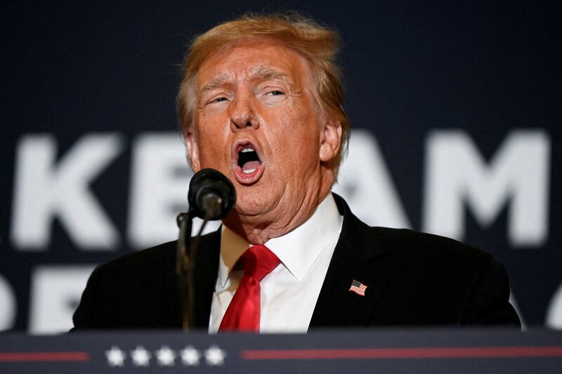 Former President and Republican presidential candidate Donald Trump speaks during a "Commit to Caucus" event for his supporters in Coralville, Iowa