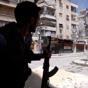 articles/2012/08/18/syrian-rebels-outgunned-but-unbroken-in-fight-for-aleppo/syria-aleppo-banco_biysuw