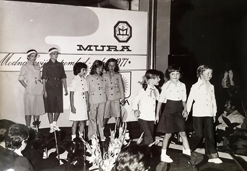 A black and white image of a children’s fashion show in Communist Yugoslavia featuring Melania Trump