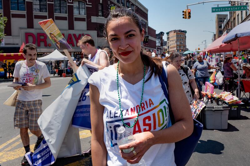 AOC wearing a pride-themed Ocasio-Cortez shirt