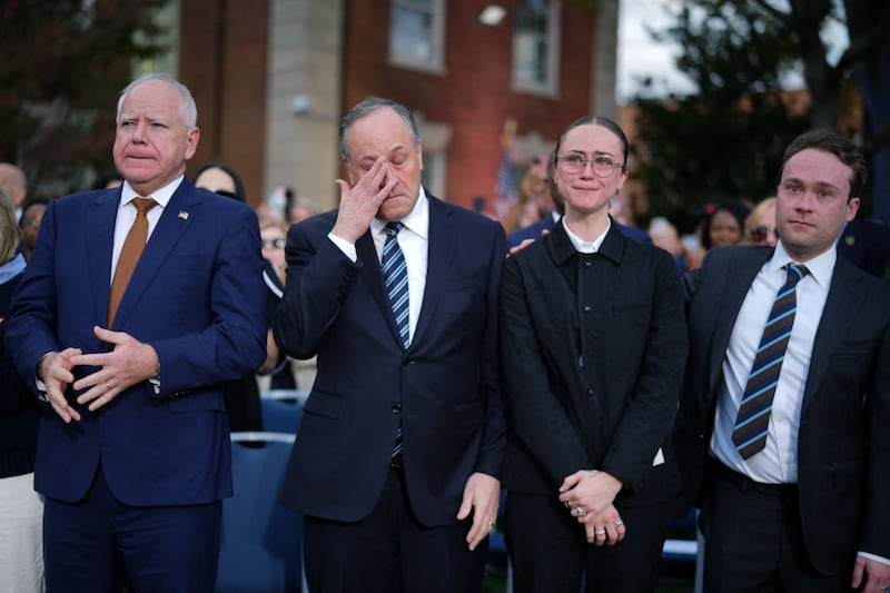 Minnesota Gov. Tim Walz, Second gentleman Doug Emhoff, Ella Emhoff and Cole Emhoff react after Vice President Kamala Harris conceded the 2024 election in a speech at Howard University.