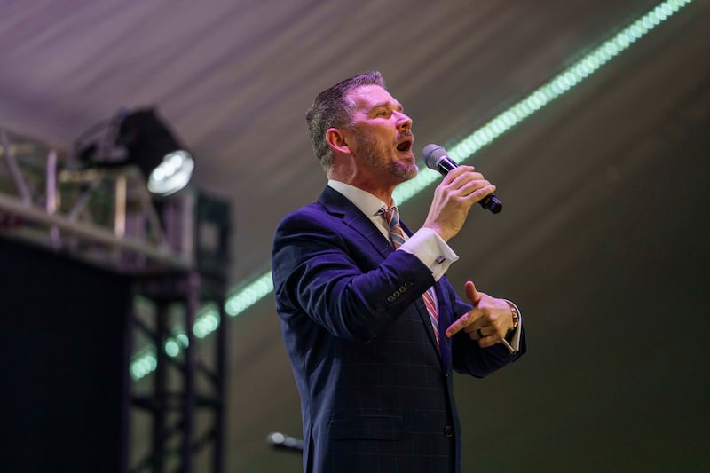 Pastor Greg Locke, the pastor of the controversial Global Vision Bible Church, preaches from the stage inside the tent on Sunday March 6, 2022.