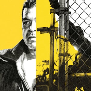 A photo illustration of an immigrant with a gate being closed on him