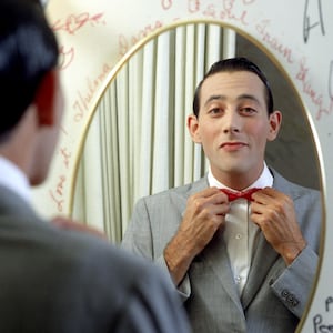 Actor Paul Reubens poses for a portrait dressed as his character Pee-wee Herman in May 1980.