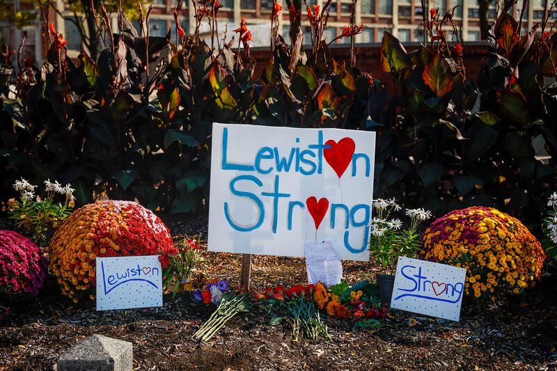 A photo including a Lewiston's strength sign along with a Bonquet of Flowers