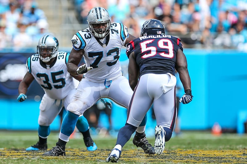 Then-Carolina Panthers tackle Michael Oher blocks Houston Texans outside linebacker Whitney Mercilus.