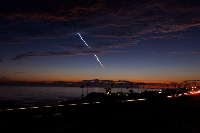 An evening launch of a SpaceX Falcon 9 rocket.