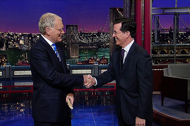 articles/2014/04/10/watch-stephen-colbert-s-first-appearance-on-the-late-show-with-david-letterman/140410-fallon-colbert-letterman_sq0bck